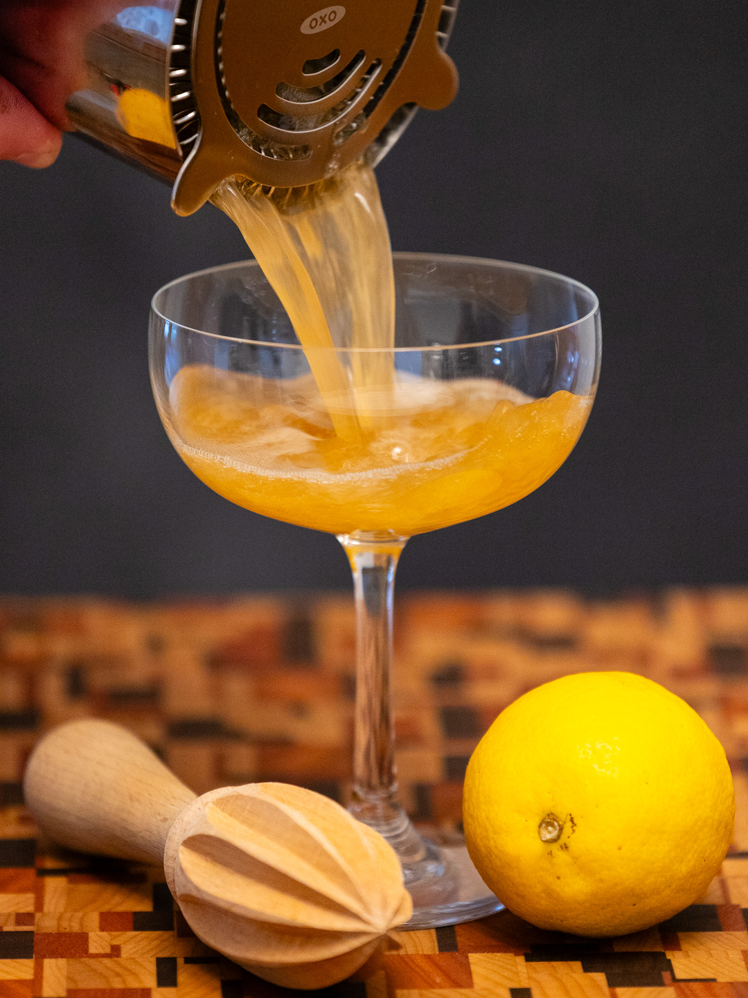 Pouring the Bella Donna Daiquiri into a coupe glass