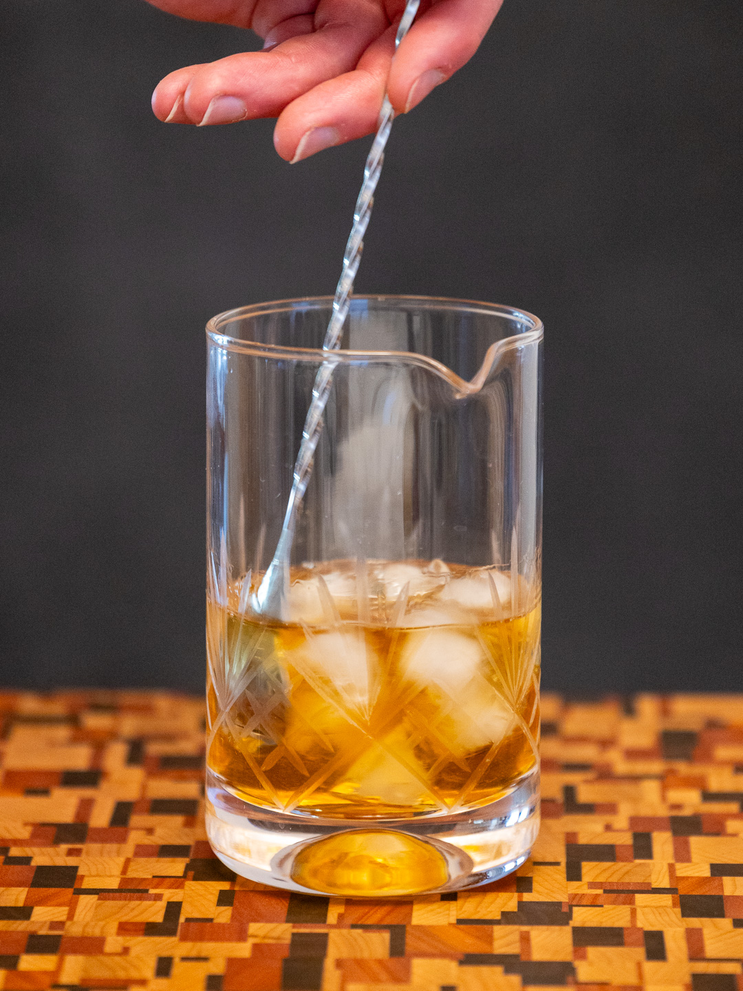 Stirring the cocktail in a mixing glass