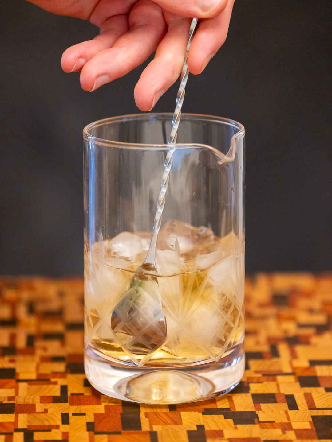 Stirring the cocktail in a mixing glass