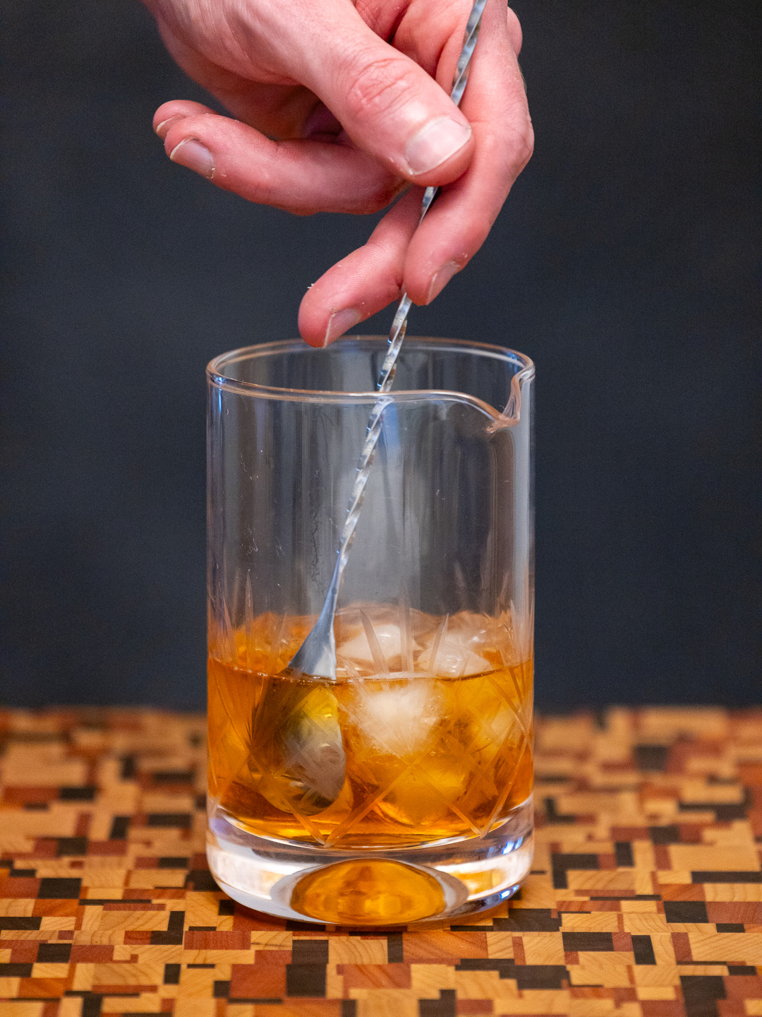 Stirring the cocktail in a mixing glass