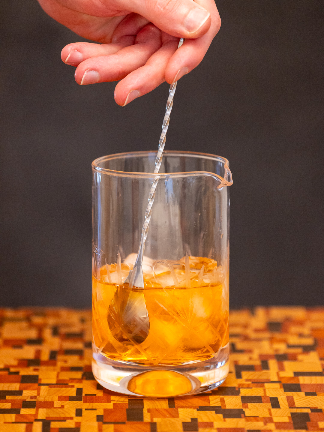 Stirring the cocktail in a mixing glass