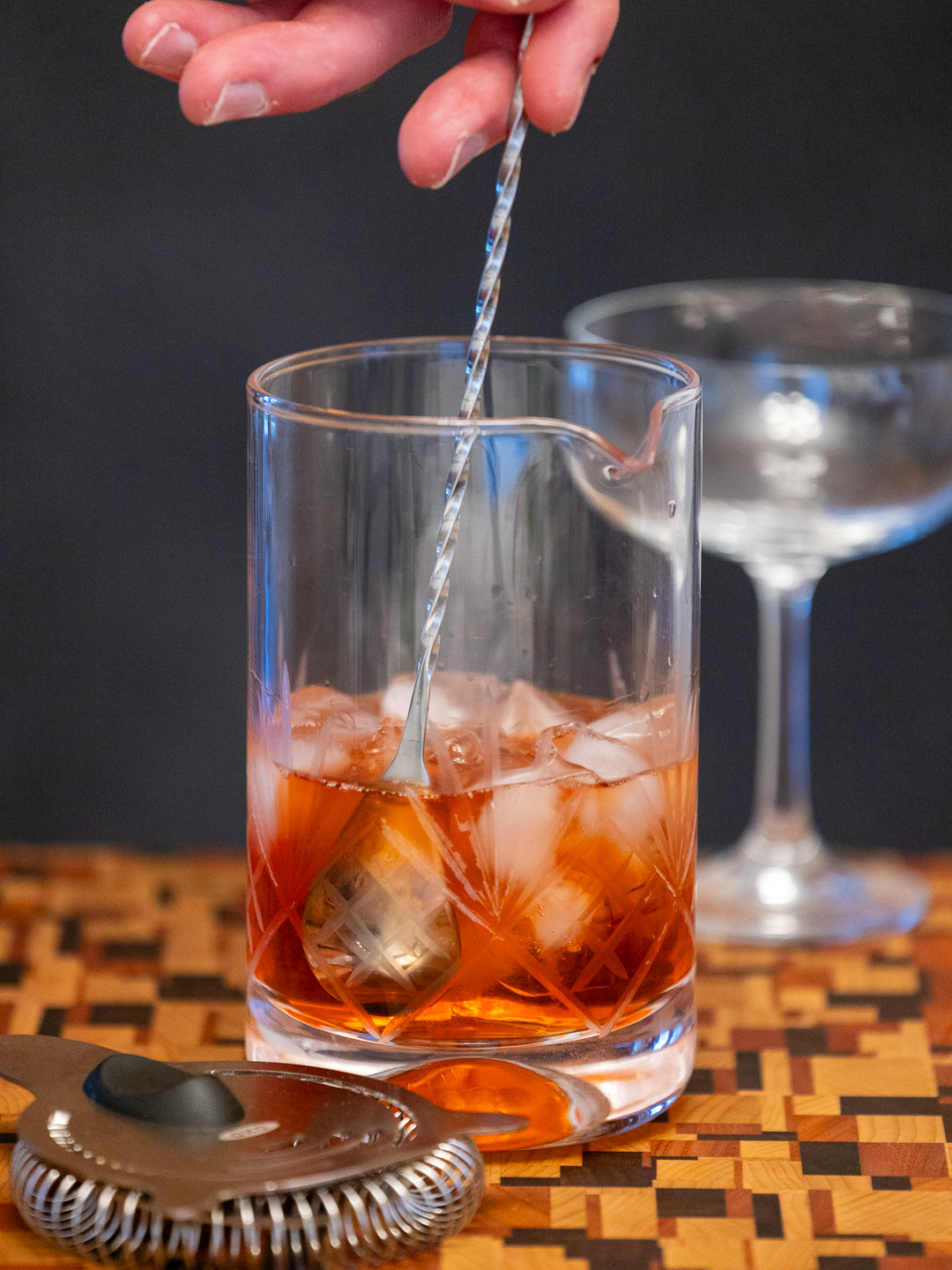 Stirring the cocktail in a mixing glass