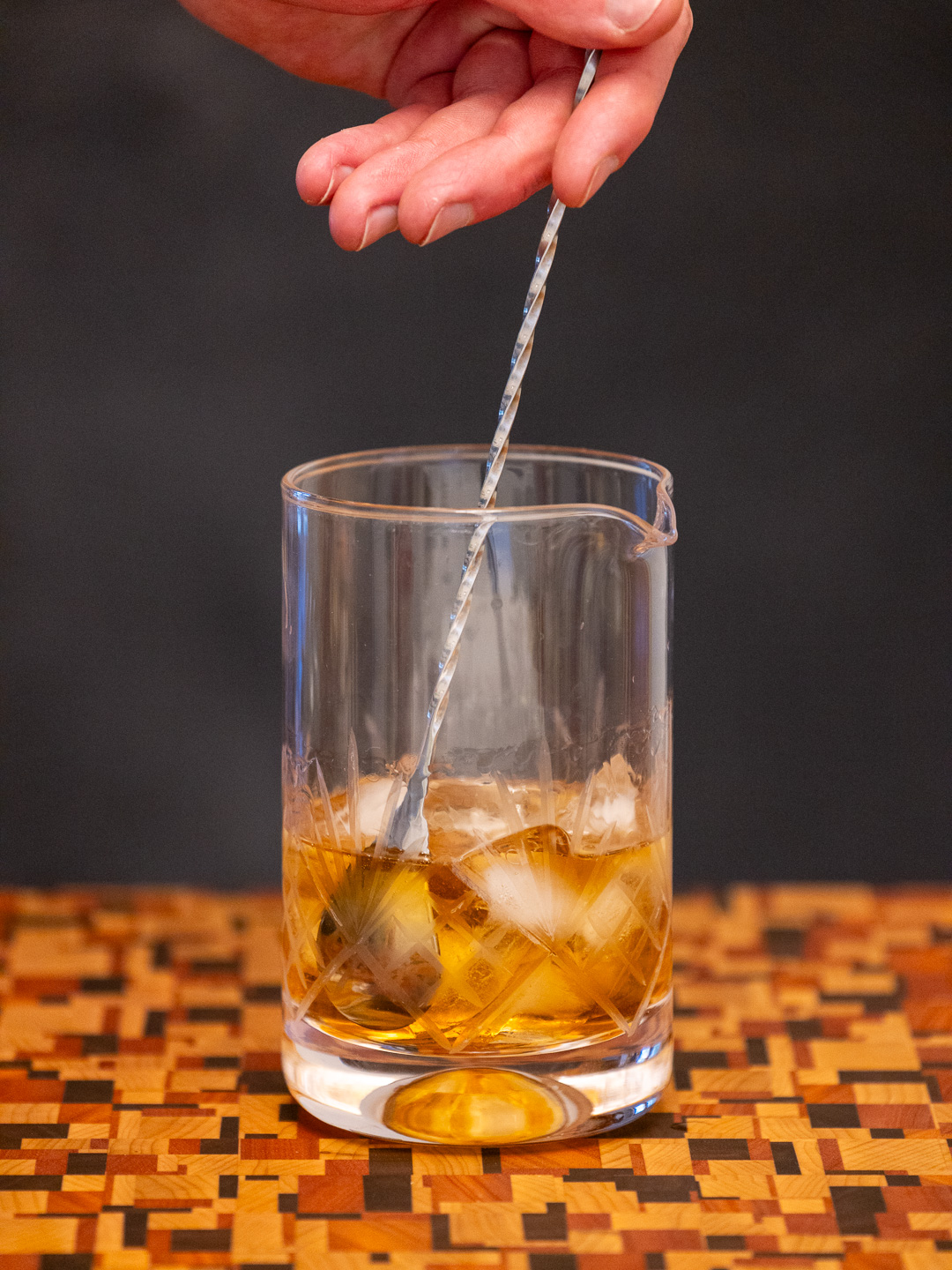 Stirring the cocktail in a mixing glass
